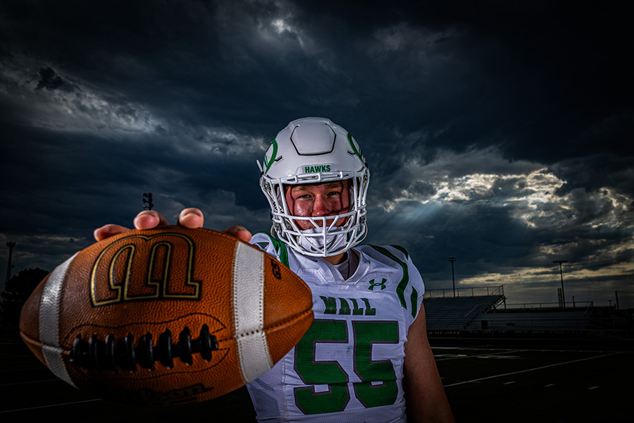 Dramatic sports portrait with smoke and colored gels